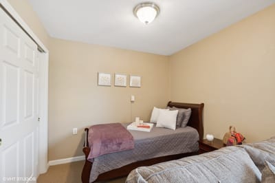 Private resident room with a bed and decor.