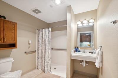 Bright and clean resident bathroom with vanity