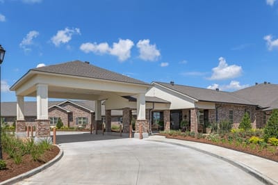 Entrance of Heritage Manor with landscaped surroundings