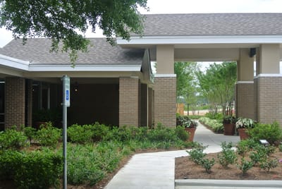 Exterior view of Zachary Manor entrance and landscaping