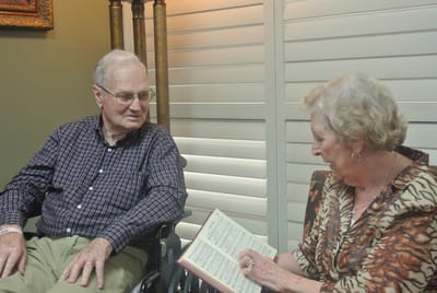 Two residents engaging in conversation in a cozy corner