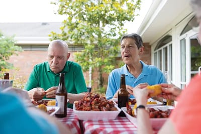 Residents enjoying a meal outdoors