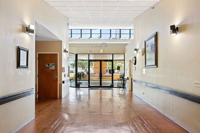 Bright interior hallway with exit to outside visible