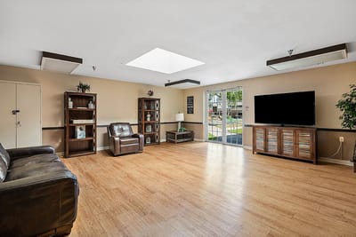 Bright common area with seating and natural light