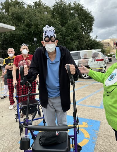 Residents celebrating outdoors with playful accessories