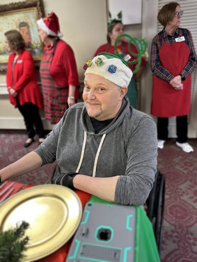 Resident participating in a festive holiday celebration