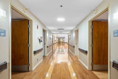 Bright hallway with resident room doors