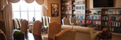 Common area with bookshelves and comfortable seating