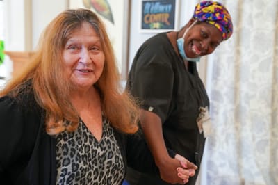 Residents and staff interacting in a common area