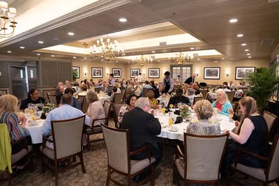 Residents enjoying a meal in a dining room