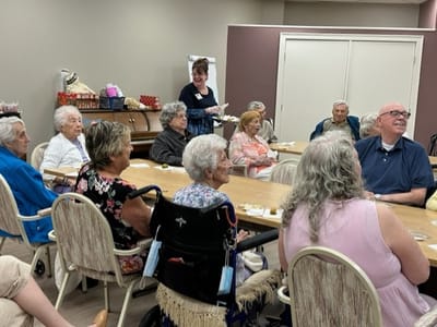 Residents engaged in a lively group activity in a common area
