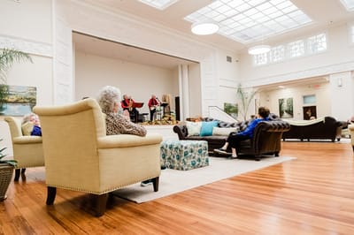 Residents enjoying a performance in a common area