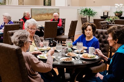 Residents enjoying a meal in the dining room