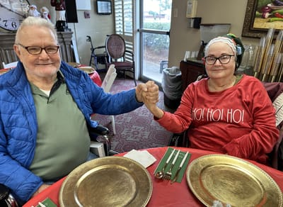 Two residents enjoying a festive gathering