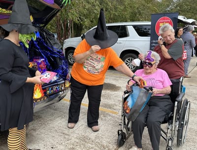 Residents participating in a Halloween event outdoors