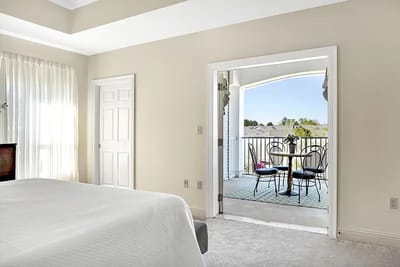 Bright interior room leading to a balcony