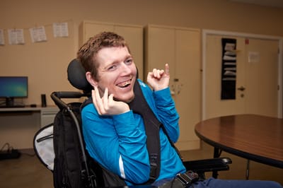 Resident enjoying a moment in the activity room