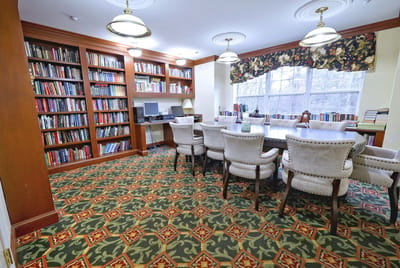 Cozy library with bookshelves and seating