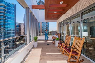 Residents enjoying a bright lounge with city views