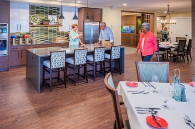 Residents interacting in a communal kitchen space