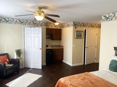 Interior view of a cozy resident room with kitchenette