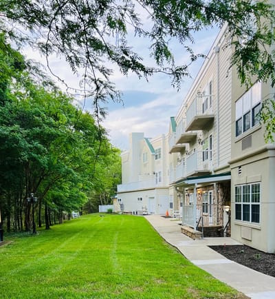 Exterior view of Cypress Creek facility with green lawn
