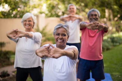 Residents participating in a outdoor exercise class