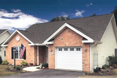 Exterior view of a brick building with an American flag