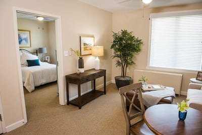 Cozy resident room with a bed and seating area