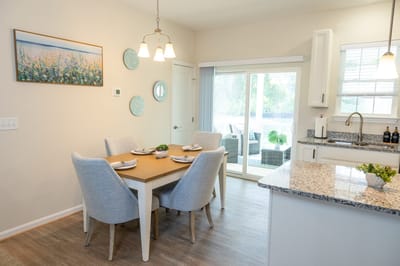 Bright dining area with a table set for meals