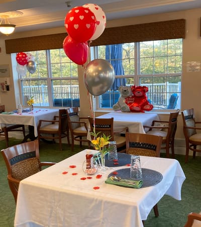 Decorated dining table with balloons and teddy bears