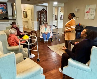 Residents engaged in conversation in a common area