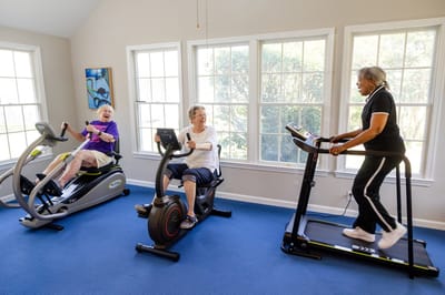 Residents exercising in an activity room
