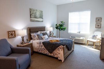 A cozy resident bedroom in an assisted living facility
