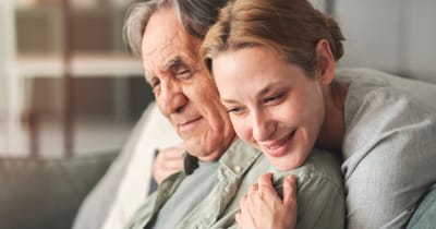 Caregiver and resident enjoying a moment together