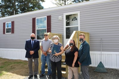 Group of people outside a facility entrance
