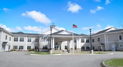 Exterior view of Bella Point Bridgton with flag