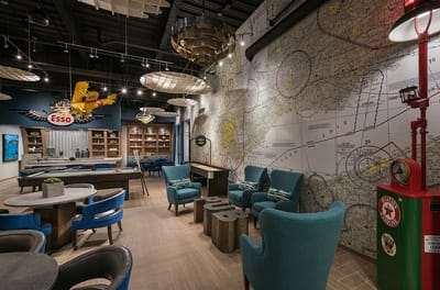 A stylish interior common area with colorful furniture and decor