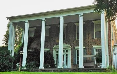 Exterior view of a historic building with columns