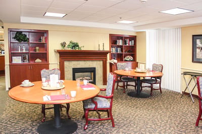 Dining area with tables and chairs in a cozy setting