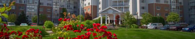 Exterior view of Freedom Village Holland with flowers