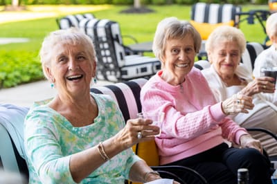 Residents enjoying drinks together in an outdoor space