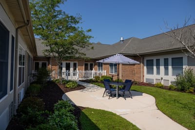 Outdoor seating area with umbrella in a garden