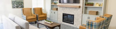 Comfortable common area with seating and fireplace