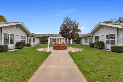 Exterior view of LakeHouse Three Rivers with garden and pathway
