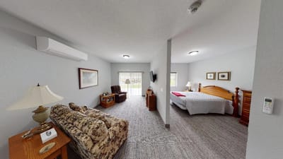 Cozy resident room with a bed and seating area