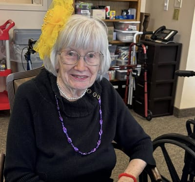 Resident in a common area wearing festive accessories