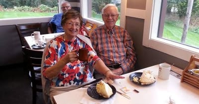 Couple enjoying dessert in a dining area