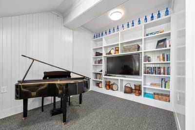 Interior view of a cozy common area with a piano
