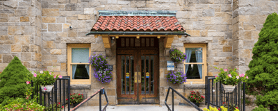 Exterior view of the facility entrance with flowers